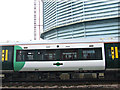 Train passing Battersea gasworks