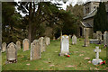 NY8497 : Gravestones at Holy Trinity Church by Trevor Littlewood