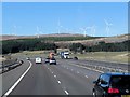 NS9915 : Clyde Wind Farm and A74(M) Motorway by David Dixon