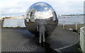 Sphere and mannequin near the edge of Cardiff Bay