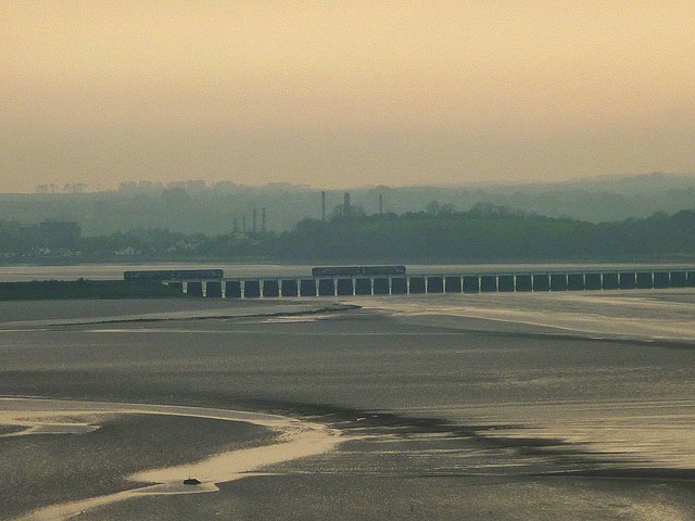 Two trains pass on the Leven Viaduct