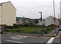 Boulders lining a vacant corner in Aberdare