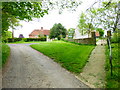 Road and path to the church in Bradley