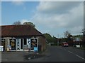 Signs outside the village shop, Funtington