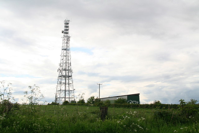Communications mast and shed with graffiti by Derby Road