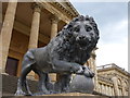 A lion in front of the south side of Stowe School