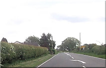 NY4365 : Approaching road junction west of Willowbank by John Firth