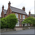 House on Ashby Road, with milestone