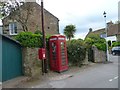 Post box, phone box and palm tree