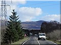 NN1879 : Power Lines Crossing the A82 near Tom na Brataich by David Dixon