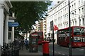 Two 49 buses passing on Gloucester Road