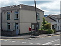 Postbox and phonebox on a High Street corner in Cefn-coed-y-cymmer