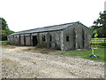 TM2691 : Old RAF building on Barford Farm by Evelyn Simak
