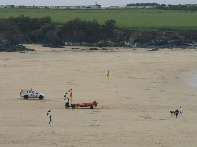 RNLI lifeguard and flags at Harlyn Bay