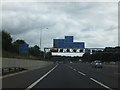 TQ5593 : Signal gantry over M25 in advance of junction for A12 by David Smith