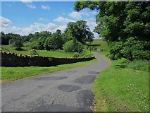 NU0043 : Country road at Berrington by Graham Robson