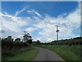 Power lines cross Walesby Road (or Lane)