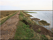 TG0244 : Sea wall damage around Blakeney Fresh Marsh by Hugh Venables
