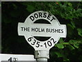 Leigh: detail of The Holm Bushes signpost