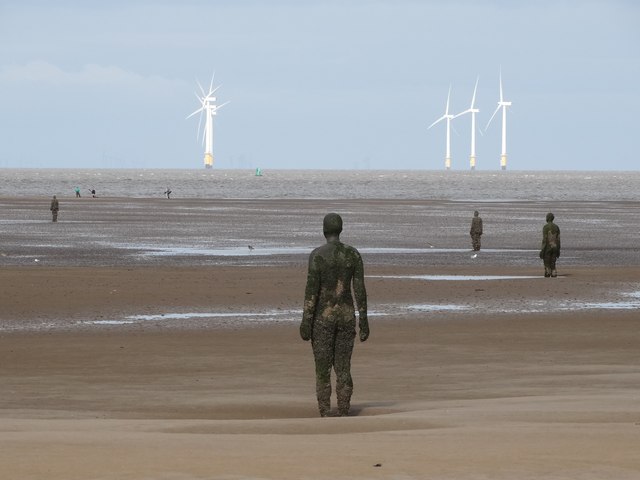 Iron men on Crosby Beach at low tide