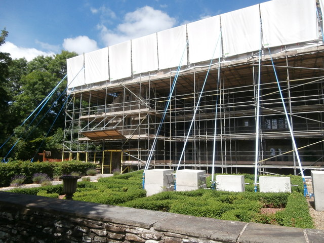 Llancaiach  Fawr enclosed in scaffolding, and its knot-garden