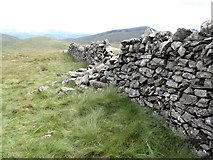 J2825 : A collapsed section of the Mourne Wall by Eric Jones