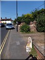 High Street, Wickham Market with iron milepost