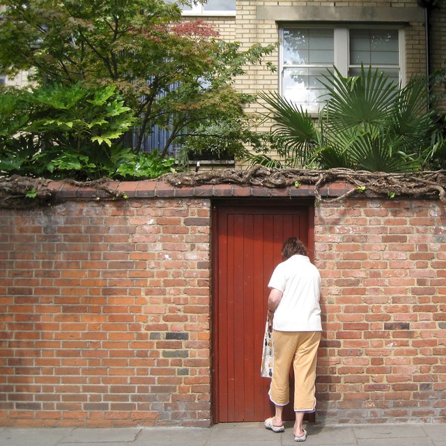 Opening a garden gate, Broadley Terrace