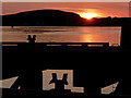NM8529 : Oban: sunset over the ferry pier by Chris Downer