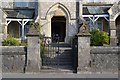 SX8570 : Mackrell’s Almshouses, Wolborough Street, southwest entrance, gate pillars and gates by Robin Stott