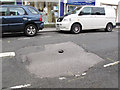 SJ7560 : Welles Street: hole in the road by Stephen Craven
