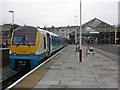 Train for Manchester stands at Llandudno