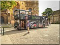 SK9771 : Tour Bus Outside Lincoln Cathedral by David Dixon