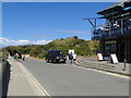 Holiday makers and a Landrover at Rock