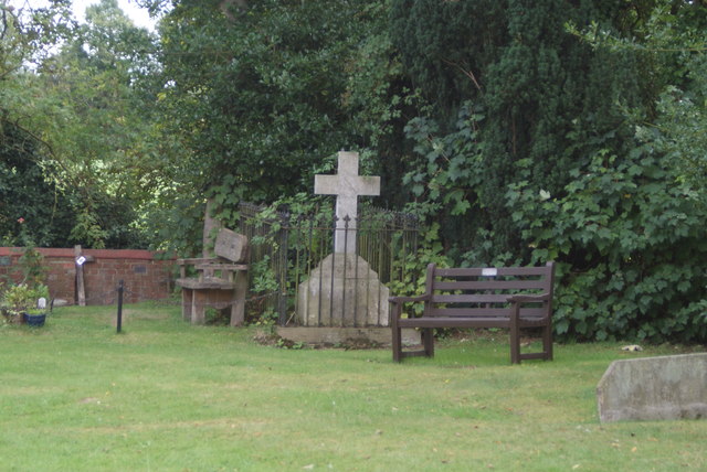 View of a gravestone in the graveyard of the wooden church