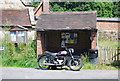 Motorbike by the bus stop