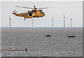 TM1714 : RNLI Volunteer leaving Sea King Helicopter, Clacton, Essex by Christine Matthews