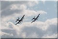 TM1713 : Two Lancasters at the Air Show, Clacton, Essex by Christine Matthews