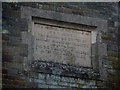 Plaque on wall of school, Blakeney