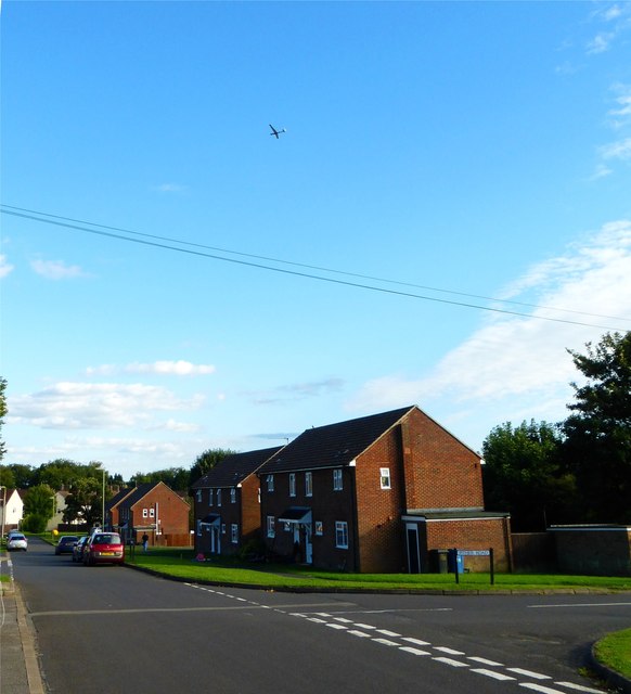 Looking along Kersley Crescent with glider above