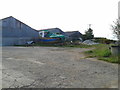 Farm buildings with a fishing boat