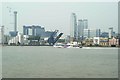 View of a Thames Clipper passing the opening West India Dock bridge