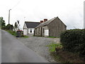 H9620 : The old and the new - a traditional cottage and a modern bungalow on Cashel Road by Eric Jones
