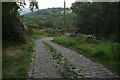 Nether Moor Road: cobbled track leading to bridge over disused railway