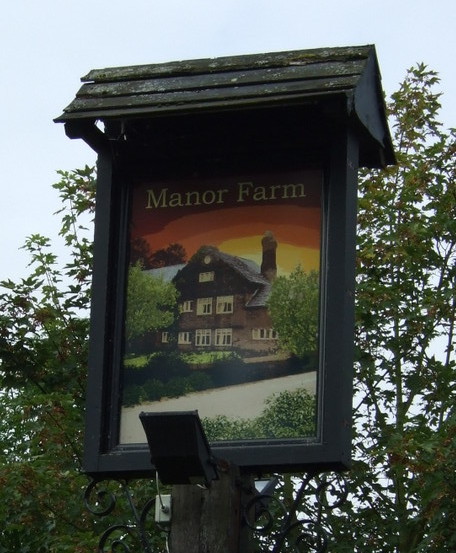 Sign for the Manor Farm pub, Rainhill