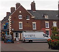 Removing the pub name sign from The George in Oswestry