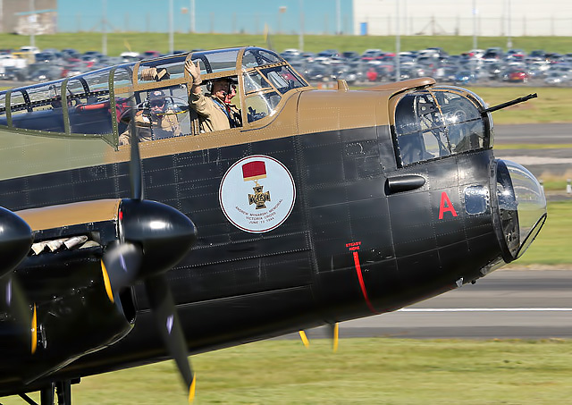 A wave from the cockpit of the Canadian Lancaster Vera