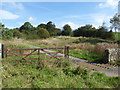 Gate and cattle grid on the track to Bullclough