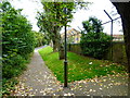 Pavement approaches Beaumont House from the west