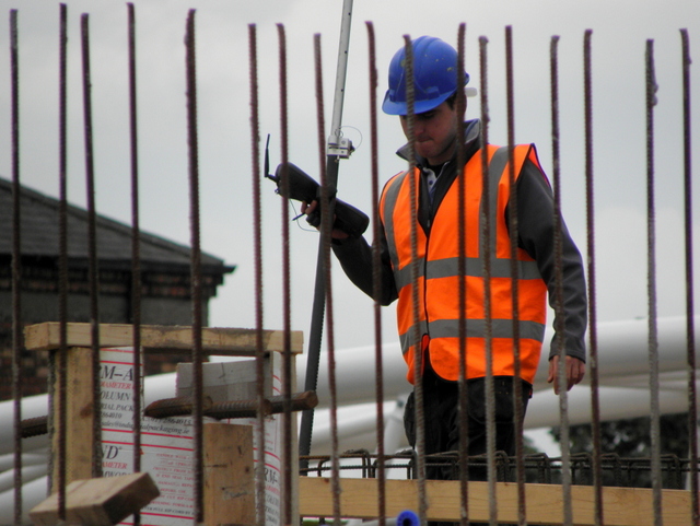 Workman behind reinforcing bars, Omagh